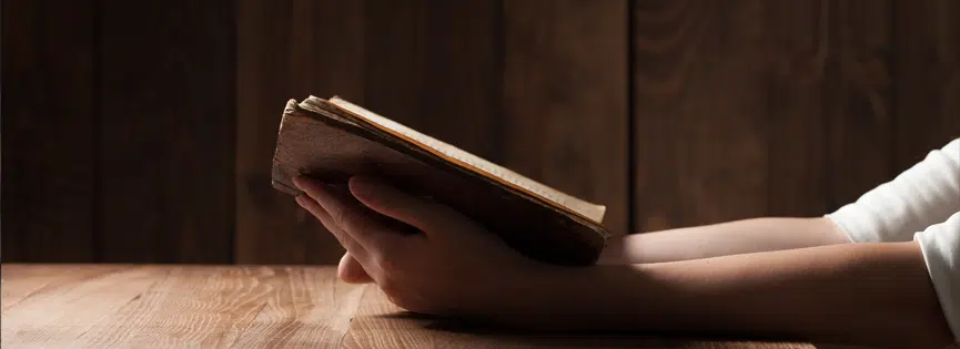 Reading Bible on Table