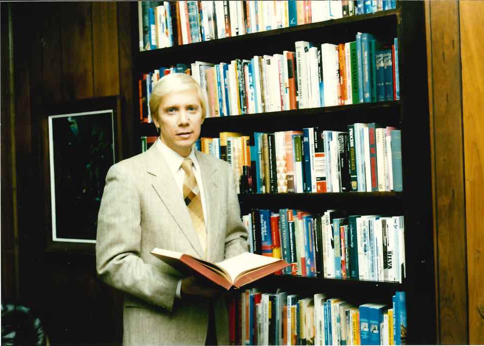 Young John by Bookcase