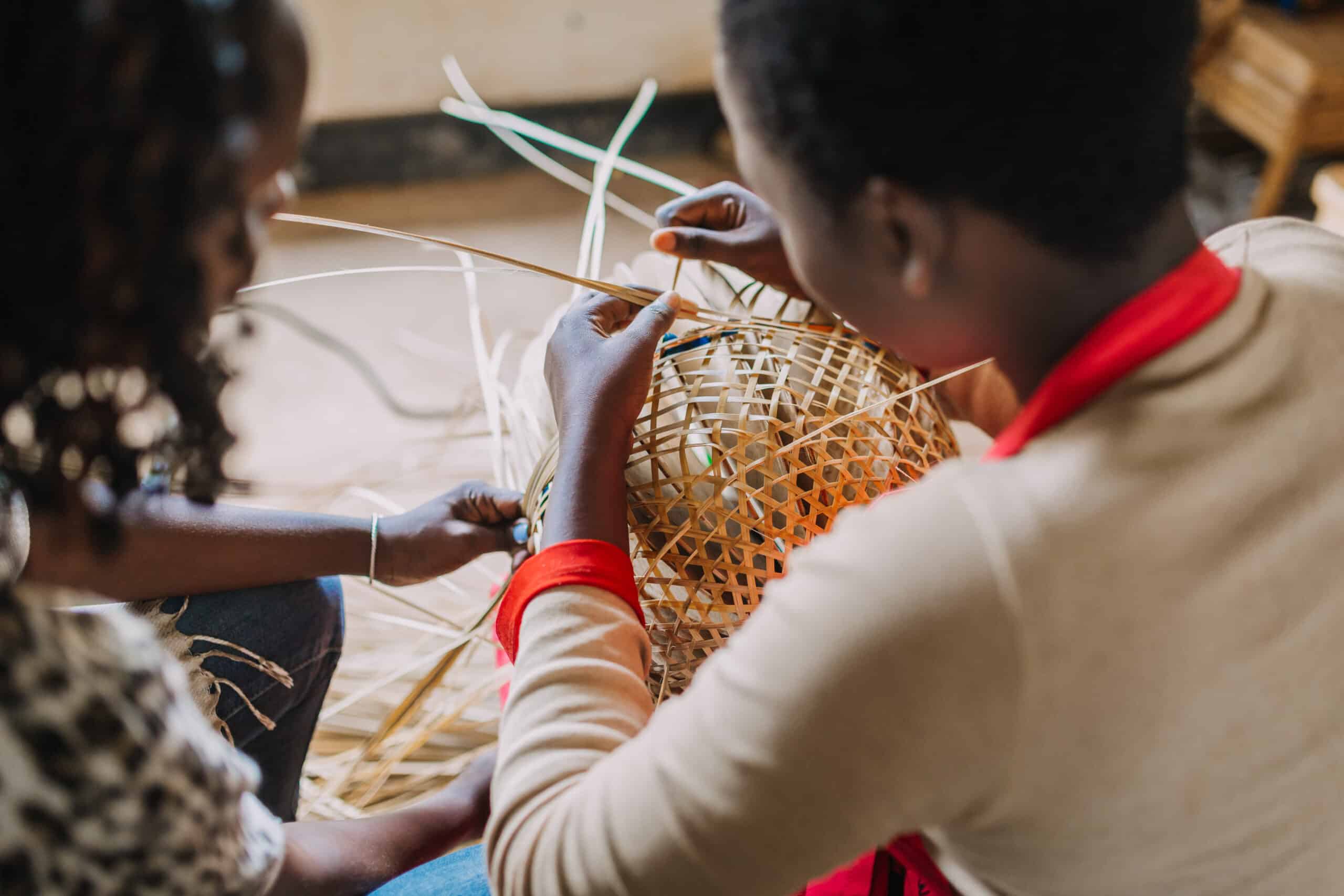 Woman,Weaving,A,Basket,Out,Of,Bamboo,In,Rwanda,Africa