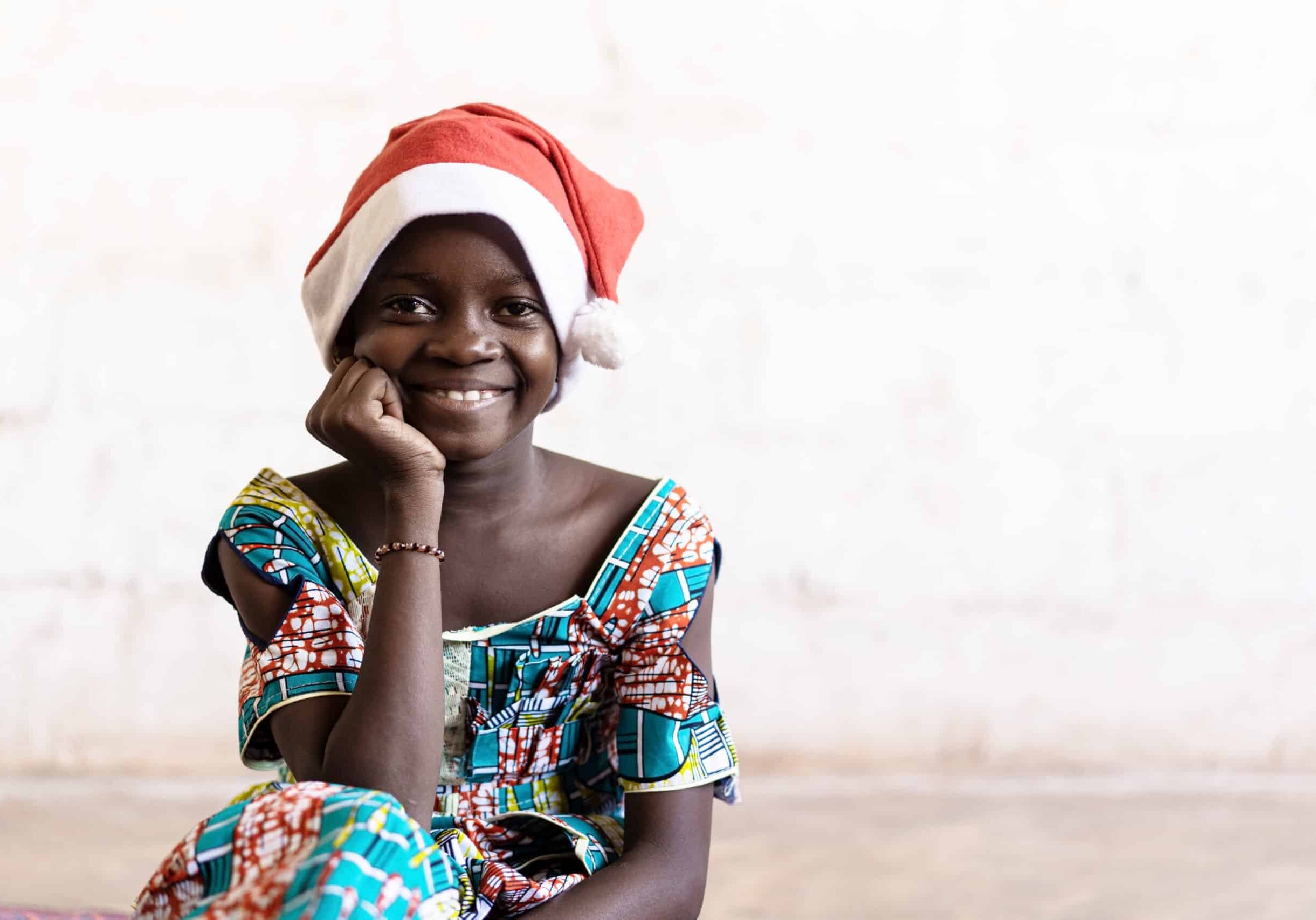 African,Girl,Happily,Smiling,In,Christmas,Hat,Portrait,With,Copy